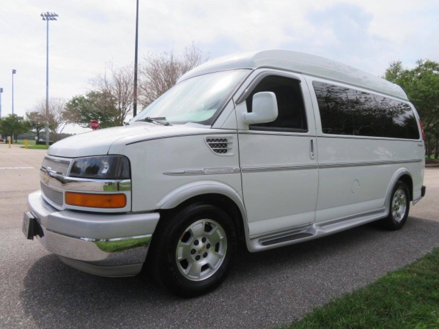 2010 White /Gray Chevrolet Express (1GNUGCD48A1) , located at 4301 Oak Circle #19, Boca Raton, FL, 33431, (954) 561-2499, 26.388861, -80.084038 - You are looking at a Gorgeous 2010 Chevy Express Handicap Wheelchair Conversion Van Explorer Limited SE with 31K Original Miles, Braun Century 750lb Side Entry Wheelchair lift, Tie Down System in the Floor, Rear Entertainment with Flat Screen TV/DVD, Leather Interior, Rear Power Folding Bench Seat/b - Photo#11